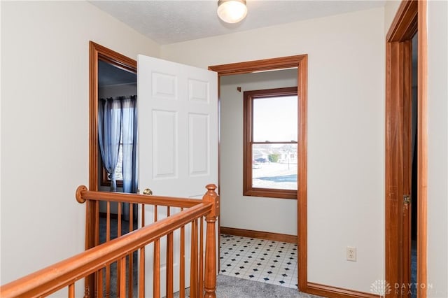 hallway featuring a textured ceiling