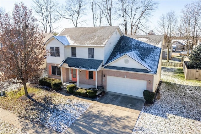 view of property featuring a porch and a garage