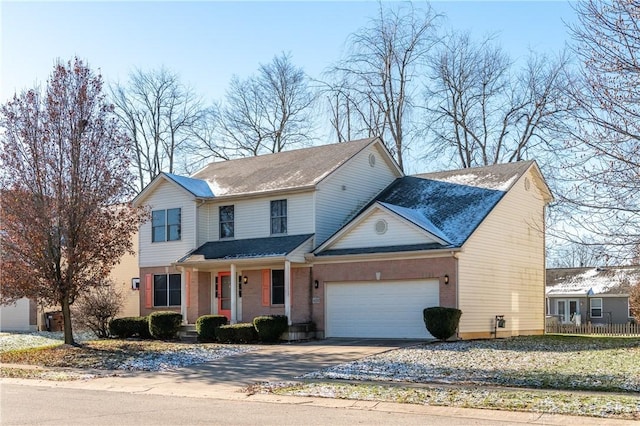 front facade with a porch and a garage