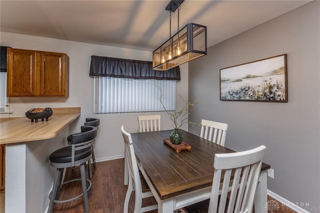 dining space featuring dark hardwood / wood-style floors