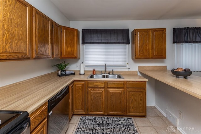 kitchen with stainless steel dishwasher, light tile patterned floors, and sink