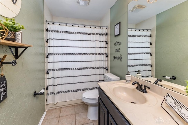 bathroom featuring toilet, vanity, tile patterned floors, and a shower with shower curtain