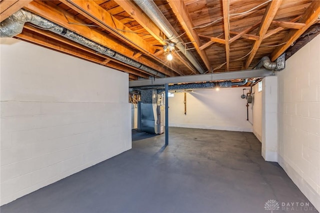 basement featuring heating unit