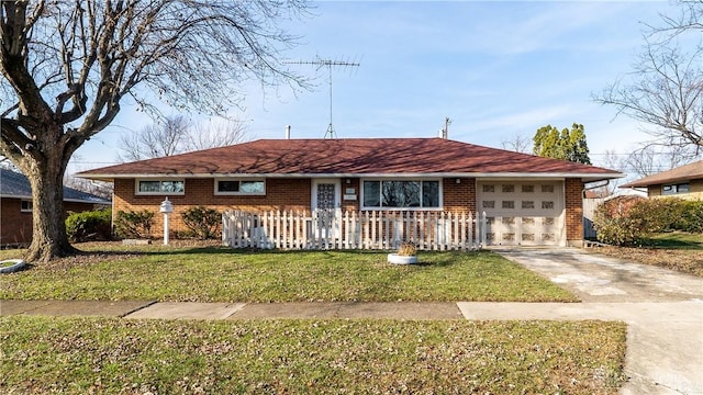 ranch-style house with a garage and a front lawn