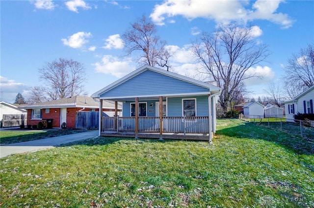 view of front of house with covered porch and a front yard