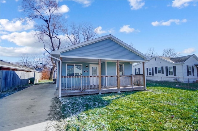 bungalow with a porch and a front lawn