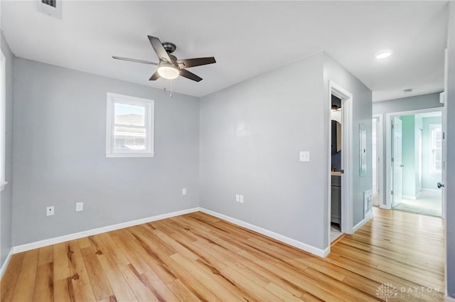 unfurnished room with ceiling fan and light hardwood / wood-style floors