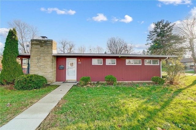 ranch-style house with a front lawn