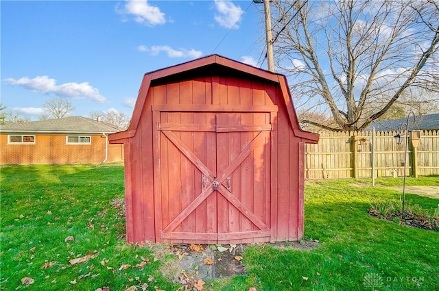 view of shed with fence