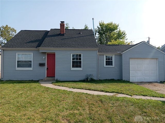 view of front of house featuring a garage and a front lawn