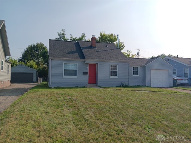 view of front of house with a garage, a front lawn, a chimney, and a shingled roof