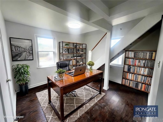 office area featuring baseboards and wood finished floors