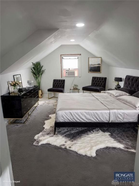 bedroom featuring carpet floors, cooling unit, and vaulted ceiling