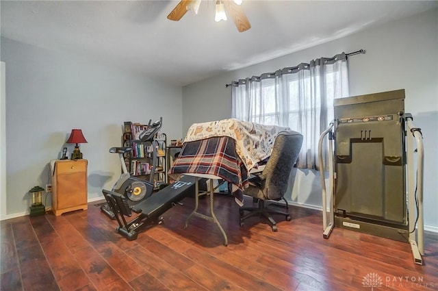 interior space featuring ceiling fan and dark hardwood / wood-style floors