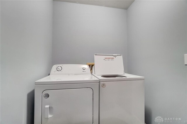 washroom featuring independent washer and dryer