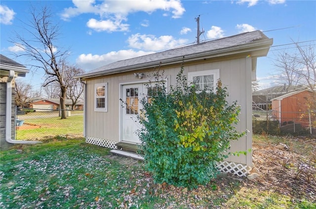 view of outbuilding with a yard