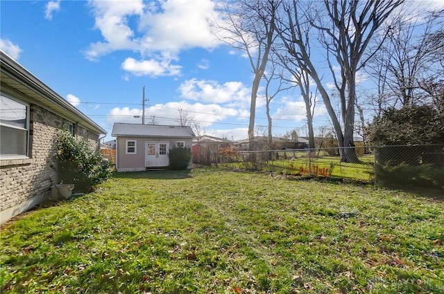 view of yard featuring a storage unit