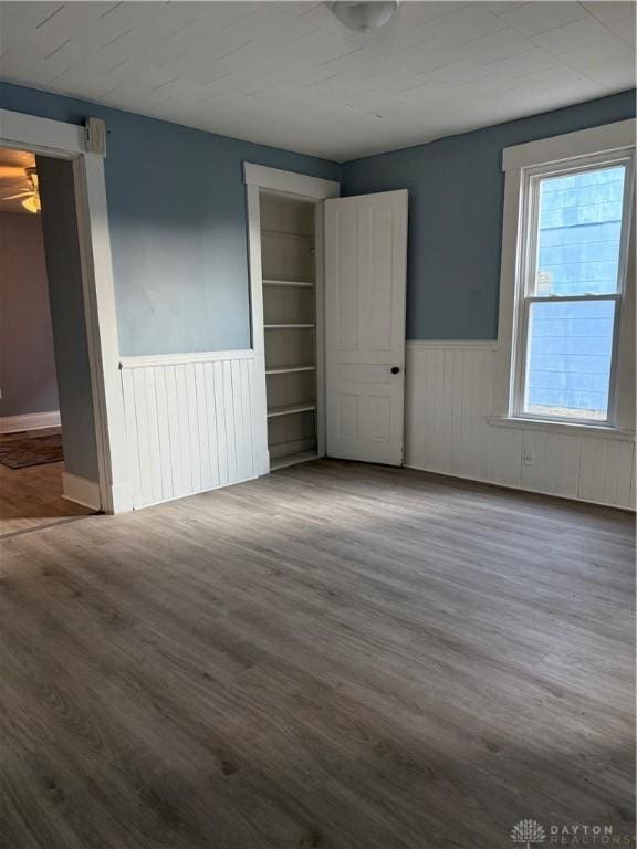 unfurnished bedroom with hardwood / wood-style floors