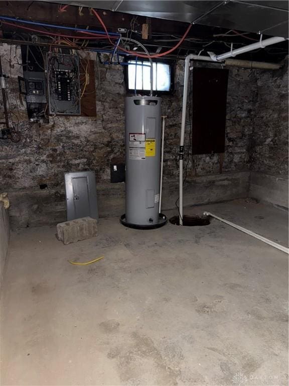 basement with electric water heater and electric panel