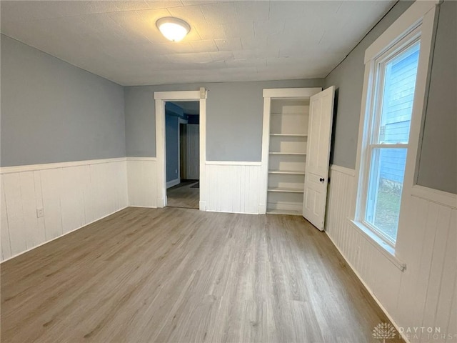 unfurnished bedroom featuring hardwood / wood-style floors