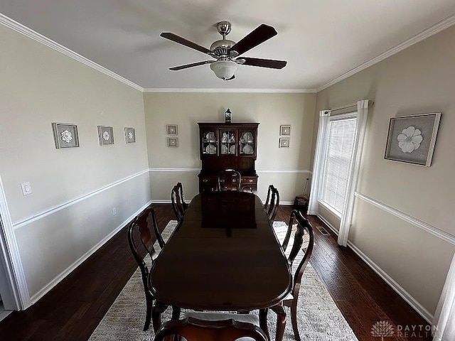 dining space with crown molding, dark hardwood / wood-style flooring, and ceiling fan