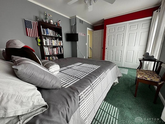 bedroom featuring carpet, a closet, ornamental molding, and ceiling fan