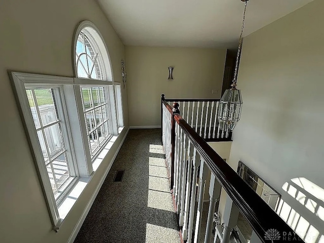 hallway with dark carpet