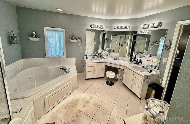 bathroom with tile patterned floors, separate shower and tub, and vanity