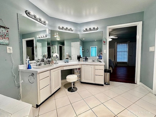 bathroom featuring tile patterned flooring, vanity, and ceiling fan