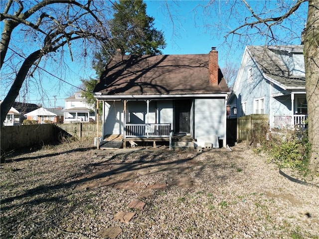 rear view of house with a porch