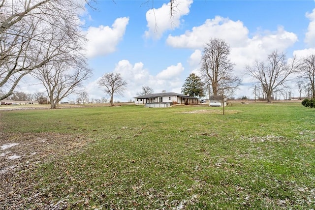 view of yard with a rural view