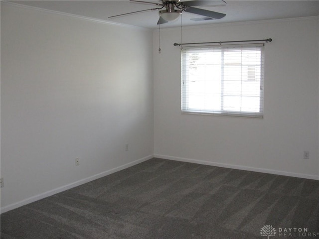 carpeted empty room with ceiling fan and ornamental molding