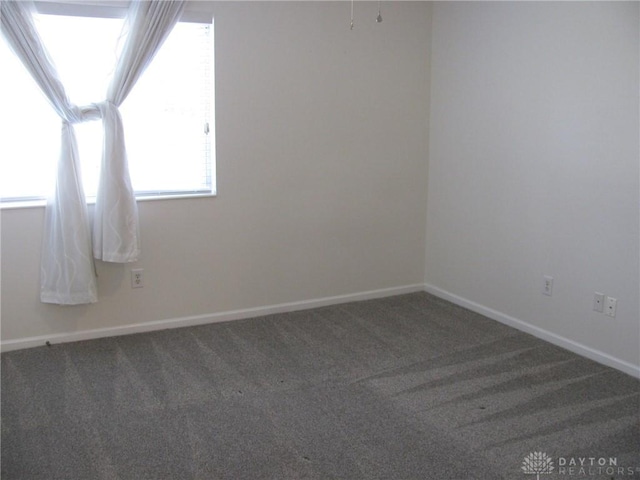 spare room featuring carpet flooring