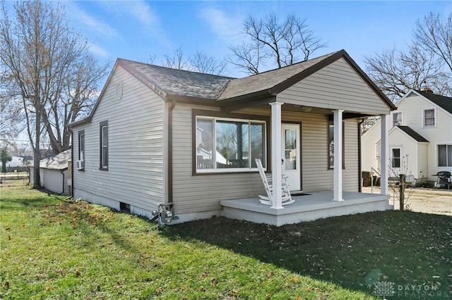 view of front of home featuring covered porch and a front yard