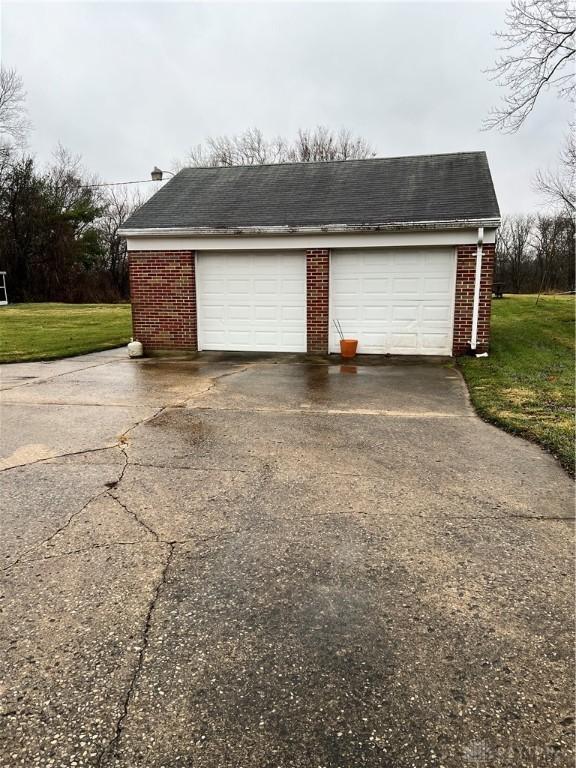 garage with a lawn