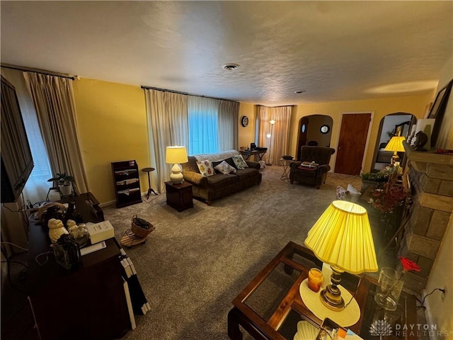 carpeted living room with a textured ceiling