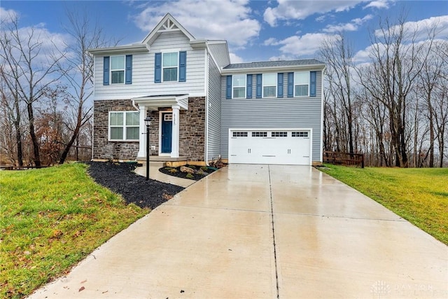 view of front of house with a garage and a front lawn