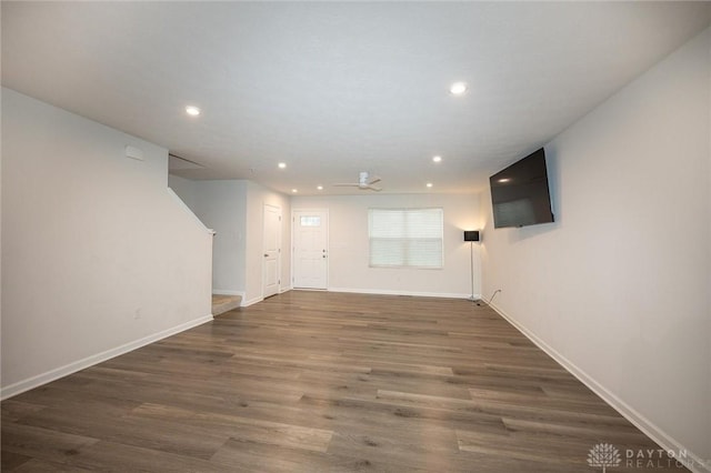 basement with dark hardwood / wood-style floors