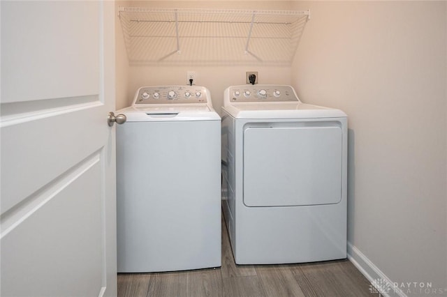 laundry room featuring hardwood / wood-style floors and independent washer and dryer