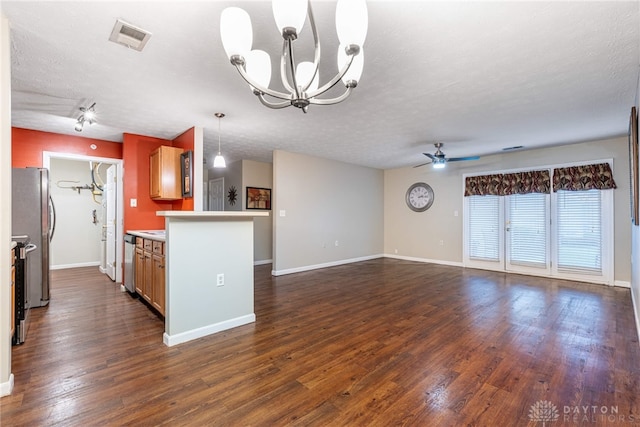 kitchen with a textured ceiling, ceiling fan with notable chandelier, dark hardwood / wood-style floors, and stainless steel appliances