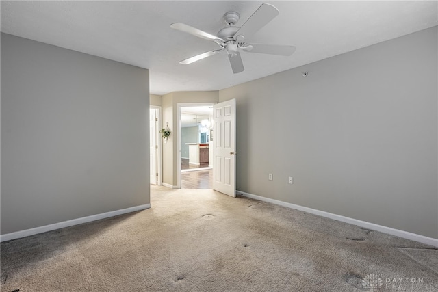 spare room with ceiling fan and carpet floors