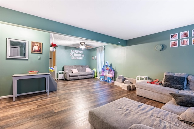 living room with hardwood / wood-style floors and ceiling fan