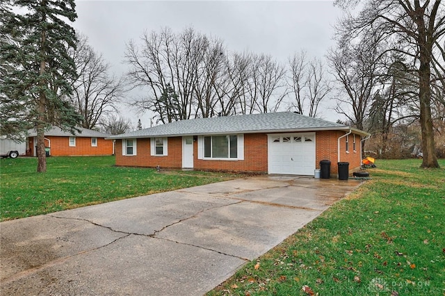 ranch-style home with a garage and a front yard