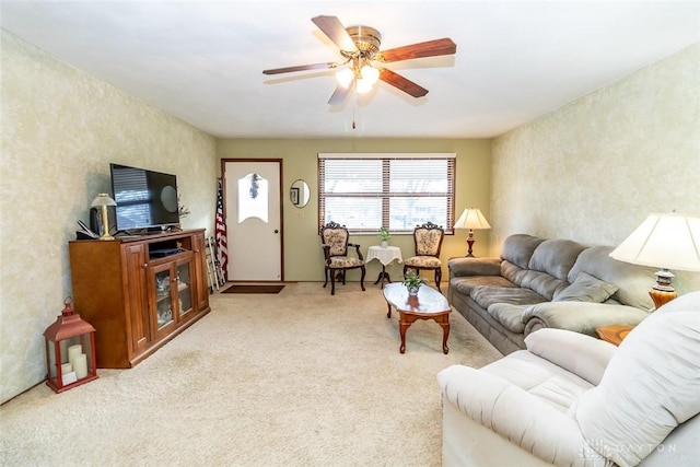 living room with light colored carpet and ceiling fan