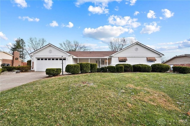 ranch-style home with a garage and a front lawn