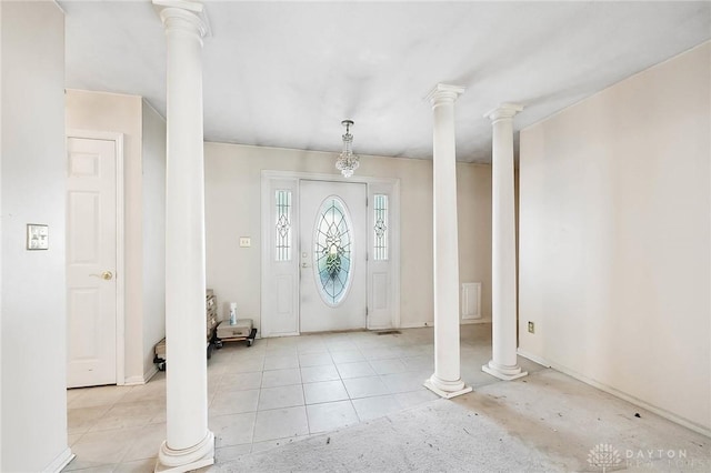 entryway with light tile patterned floors