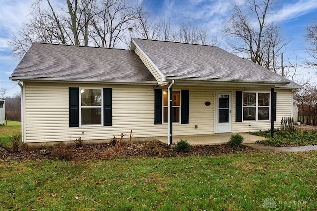 view of front of home with a front lawn