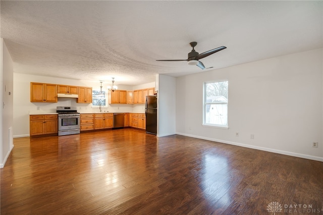 kitchen featuring ceiling fan with notable chandelier, appliances with stainless steel finishes, dark hardwood / wood-style flooring, and a textured ceiling