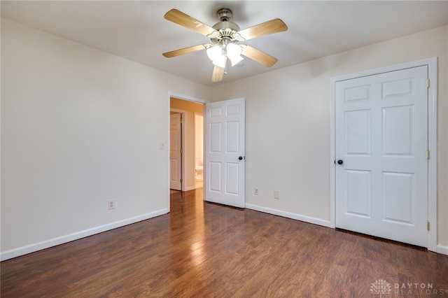 unfurnished bedroom with dark hardwood / wood-style flooring and ceiling fan