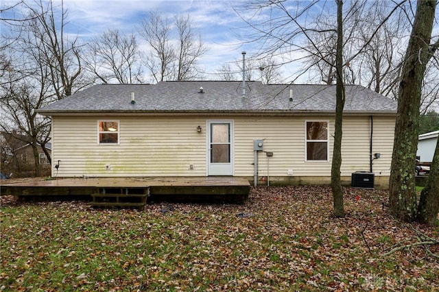 rear view of property with central air condition unit and a deck